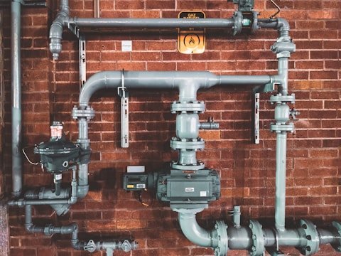 Person, Plumbing, Brick, Pipeline.