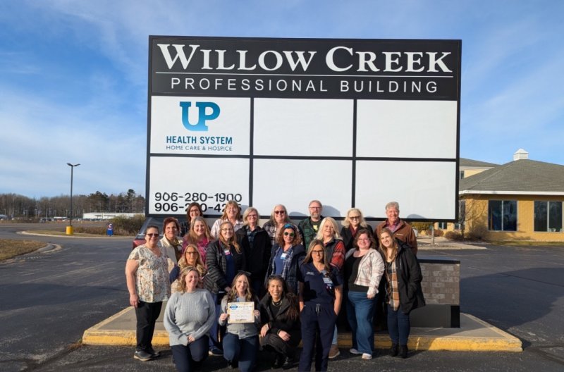 People, Jacket, Shelter, Jeans. Text: WILLOW CREEK PROFESSIONAL BUILDING UP HEALTH SYSTEM HOME CARE &amp; HOSPICE 906-280-1900