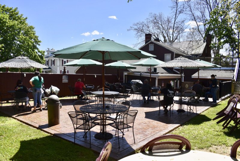 Shelter, Grass, Dining Table, Restaurant. Text: Love