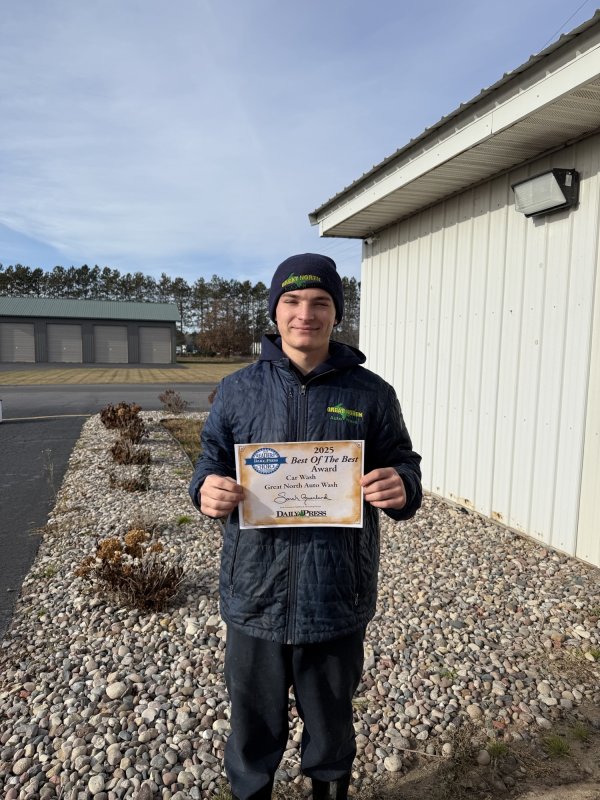 Pants, Portrait, Soil, Gravel. Text: GREAT NORTH 2025 READERS DAILY PRESS Best Of The Best Award Car Wash Great North Auto Wash DAILY PRESS