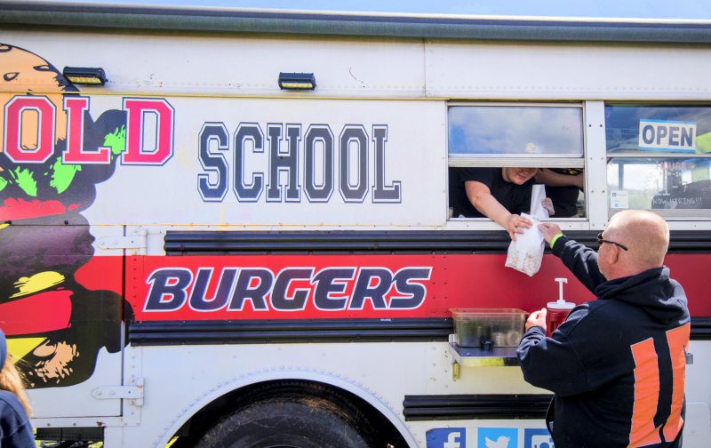 Adult, Male, Man, Person. Text: OLD SCHOOL OPEN HOURS BURGERS