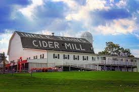 Grass, Hotel, Lawn, Outdoors. Text: CIDER MILL