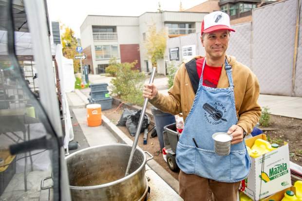 Stirring Food, Baseball Cap, Person, Worker. Text: P ASPEN Mazola