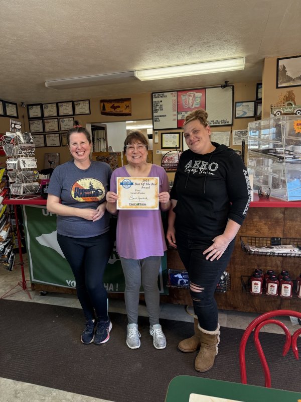 Pants, T-Shirt, Shoe, Portrait. Text: $8.00 HOT PASTIES FROZEN PASTIES Sprite CHEESEBURGER CHIPS 250 SNAILS OR SPECIAL ORDERS SN YOUR AERO Eighty Seven 2025 Best Of The Best MICHIGAN Award Pasty YO