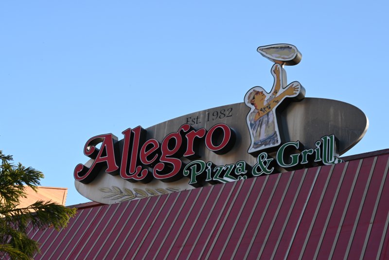 Logo, Emblem, Symbol, Restaurant. Text: Est. 1982 Pizza &amp; Grill