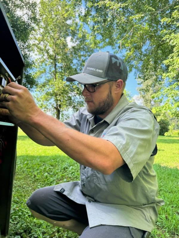 Baseball Cap, Grass, Photography, Person. Text: COPELAND