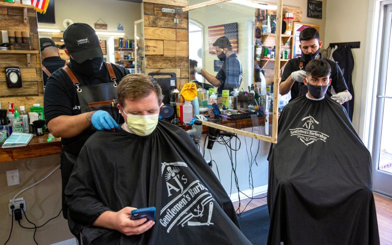 Barbershop, Indoors, Glove, Person. Text: adidas PINAUD Hand Centlemen&#039;s Barbershop Gentlemen&#039;s Barb