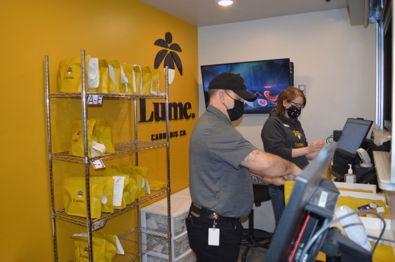 Adult, Male, Man, Person. Text: Lume. A-E Lume. CANN BIS CO. Lume. Lume