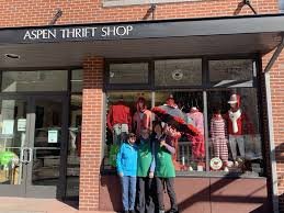 Shop, Person, Window Display, Book. Text: ASPEN THRIFT SHOP