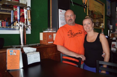 T-Shirt, Portrait, Table, Restaurant. Text: RS LAMBEAU FIELD lite ESTABLISHED 2014 Bar &amp; Grill