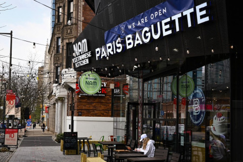 City, Street, Urban, Sidewalk. Text: WE ARE OPEN NAM VIETNAMESE PARIS BAGUETTE KITCHEN NAM CY 10 3 76 5 10