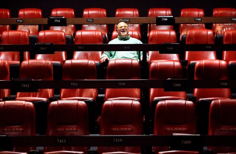 People, Person, Cinema, Man. Text: 7709 7708 7711 7710 7712 7713 7608 7611 7610 13 7609 7612 7510 7508 7511 7509 7512 ALAMO ALAMO ALAM ALAMO ALAMO 7410 7411 7409