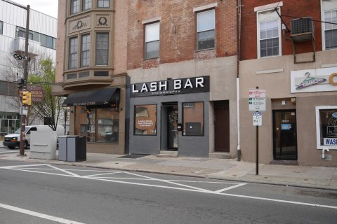 City, Road, Street, Neighborhood. Text: LASH BAR SOM Philadelphia NO STOPPING HOUSE BUS ZONE FINE AFGHAN CUISINE 1302 926601 Lashes-Brows Teeth Whitening Tooth Gems 1302 S ope ALTE