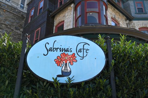 Logo, Sign, Outdoors, Flower. Text: Sabrinas