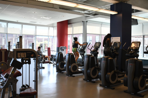 Adult, Male, Man, Person. Text: FITNESS CENTER