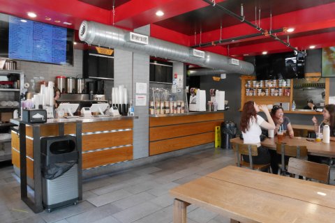 Indoors, Restaurant, Cafeteria, Cafe. Text: ORDER PICK UP FOOD