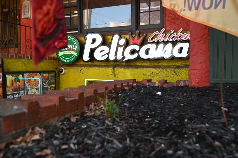 Brick, Wall, Soil, Art. Text: 4002 CHICKEN Since 1982 FRESH&amp; DELICIOUS Pelicana EATER Beer Takeout