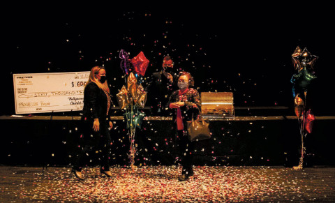 Adult, Female, Person, Woman. Text: HOLLYWOOD DATE 12/27 destination $ 600 PAY TO THE ORDER OF SIXTY THOUSAND Hollywood SIG MEMO