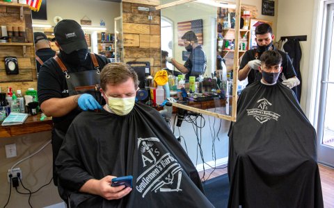 Barbershop, Indoors, Glove, Person. Text: adidas PINAUD Hand Centlemen&#039;s Barbershop Gentlemen&#039;s Barb