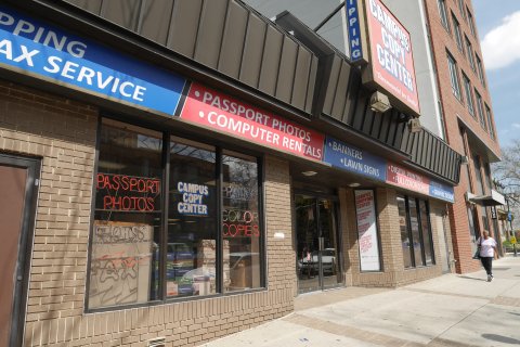 Path, Walkway, Person, Handbag. Text: COPY CENTER PASSPORT PHOTOS COMPUTER RENTALS BANNERS LAWN SIGNS DIGITAL PRINTING FULL COLOR COPIES PASSPORT CAMPUS PRINTING COPY CAMPUS SHIPPING BUCKS CENTER CENTER COLOR INTERNATIONAL DOMESTIC CAMPUS SHIPPING PACK...