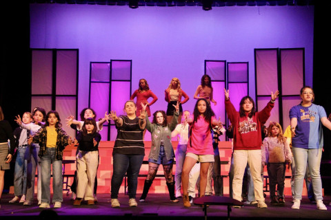 Stage, Purple, Pants, Person. Text: 76 KLYN