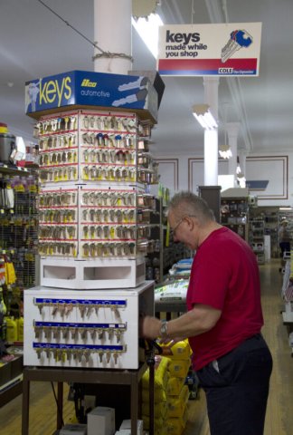 Adult, Male, Man, Person. Text: keys made while you shop COLE ilco automotive