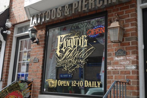 Brick, Handrail, Restaurant, Lamp. Text: OPEN PIERCING 1729A 1729B NOTICE NO SOLICITING IS ALLOWED OPEN 12~10 DAILY