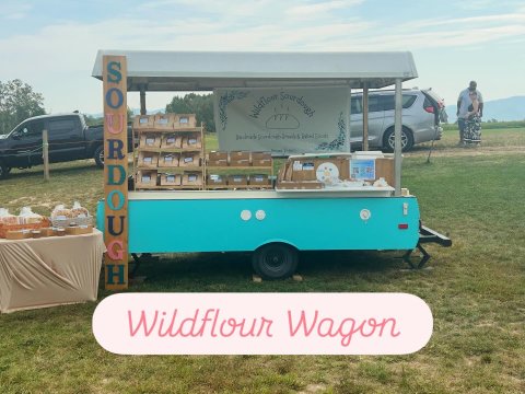 Vehicle, Person, Truck, Car. Text: Wildflour Sourdough Handmade Sourdough Breads &amp; Baked Goods Verona Virginia Wildflour Wagon