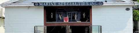 Building, Person, Shop, Window - Broken. Text: 235 MARINE SPECIALTIES INC. 235