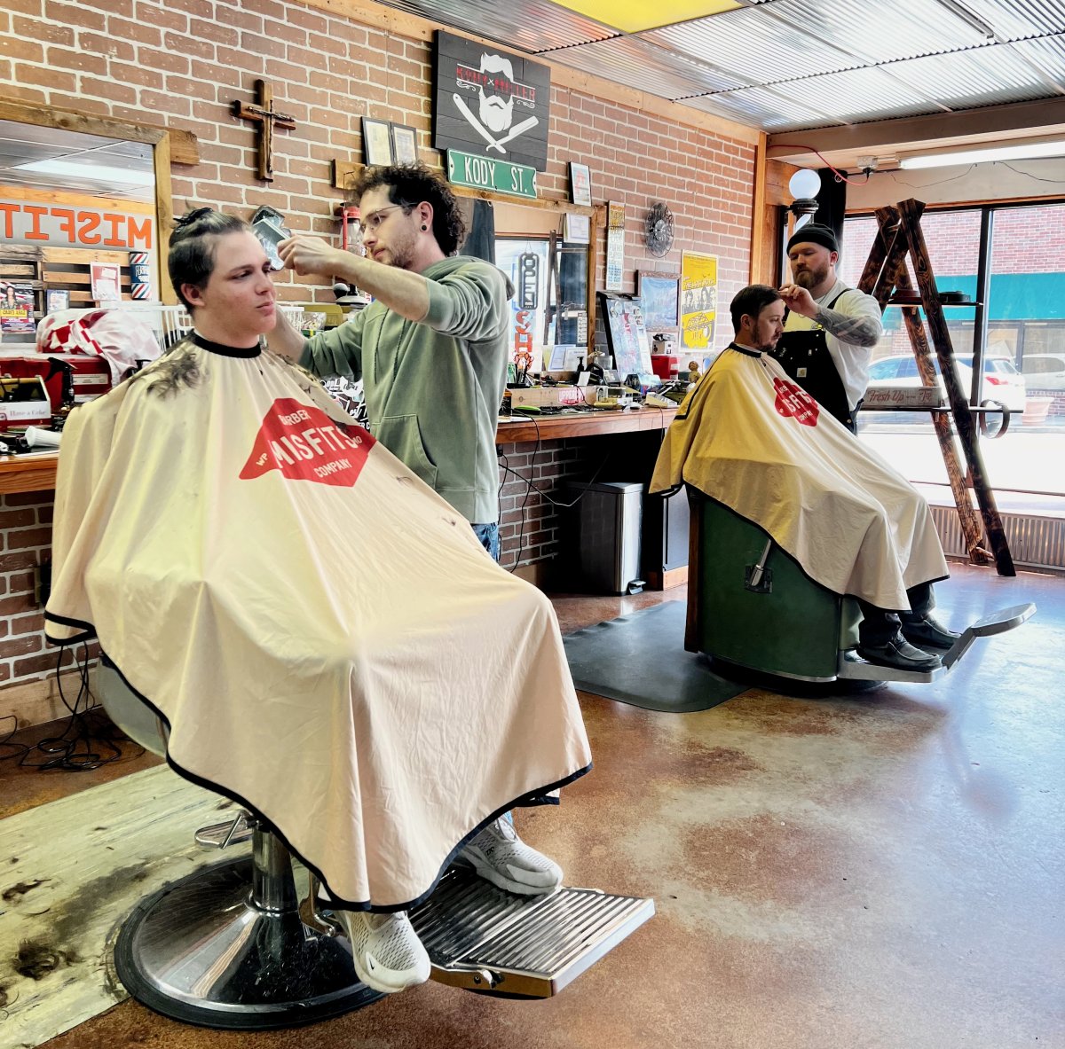 Barbershop, Indoors, Shoe, Person. Text: KODY ST. BARBER MISFITS COMPANY
