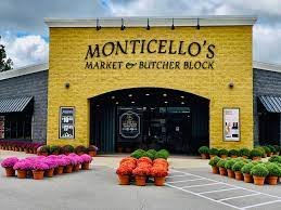 Shop, Factory, Indoors, Vehicle. Text: MONTICELLO&#039;S