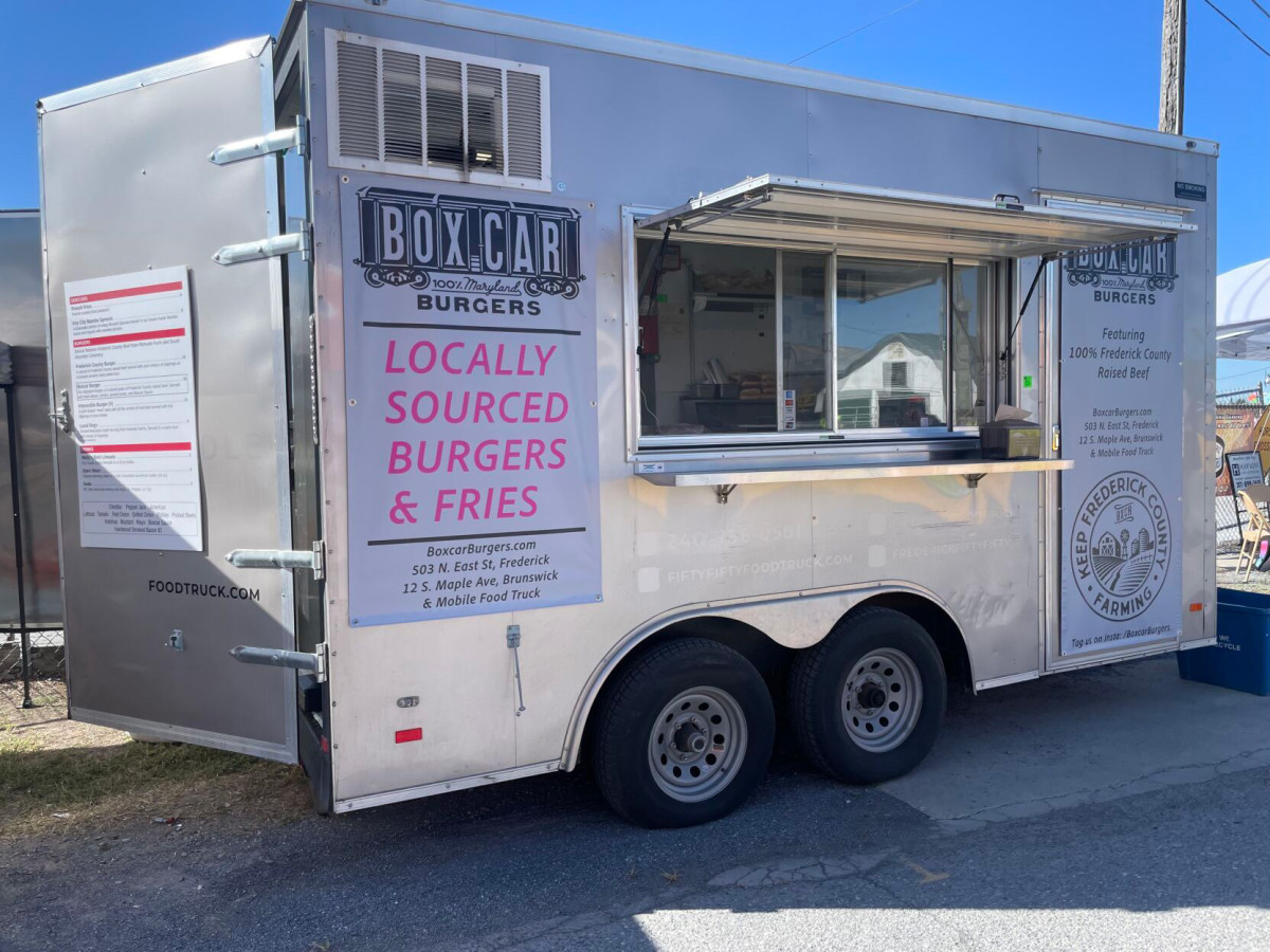 Vehicle, Truck, Food Truck, Moving Van. Text: SMOKING BURGERS BURGERS Featuring LOCALLY 100% Frederick County Raised Beef SOURCED 12 S. Maple Ave, Brunswick BURGERS OSS &amp; Mobile Food Truck &amp; FRIES BoxcarBurgers.com 503 N. East St, Frederick FOO...