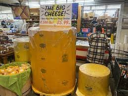 Shop, Adult, Man, Person. Text: THE BIG CHEESE!