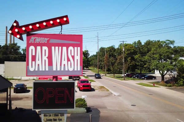 Hotel, Advertisement, Sign, Motel. Text: KWIK CAR WASH OPEN