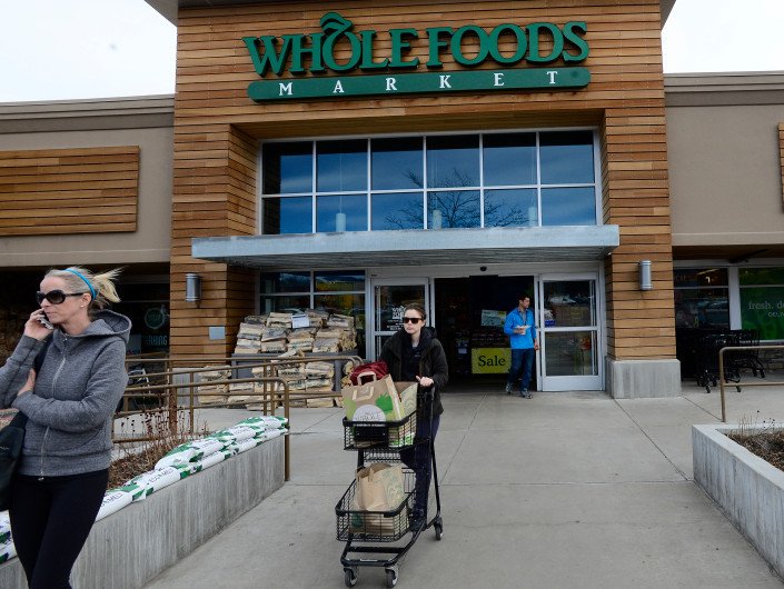 Person, Walking, Path, Woman. Text: WHOLEFOODS Sale