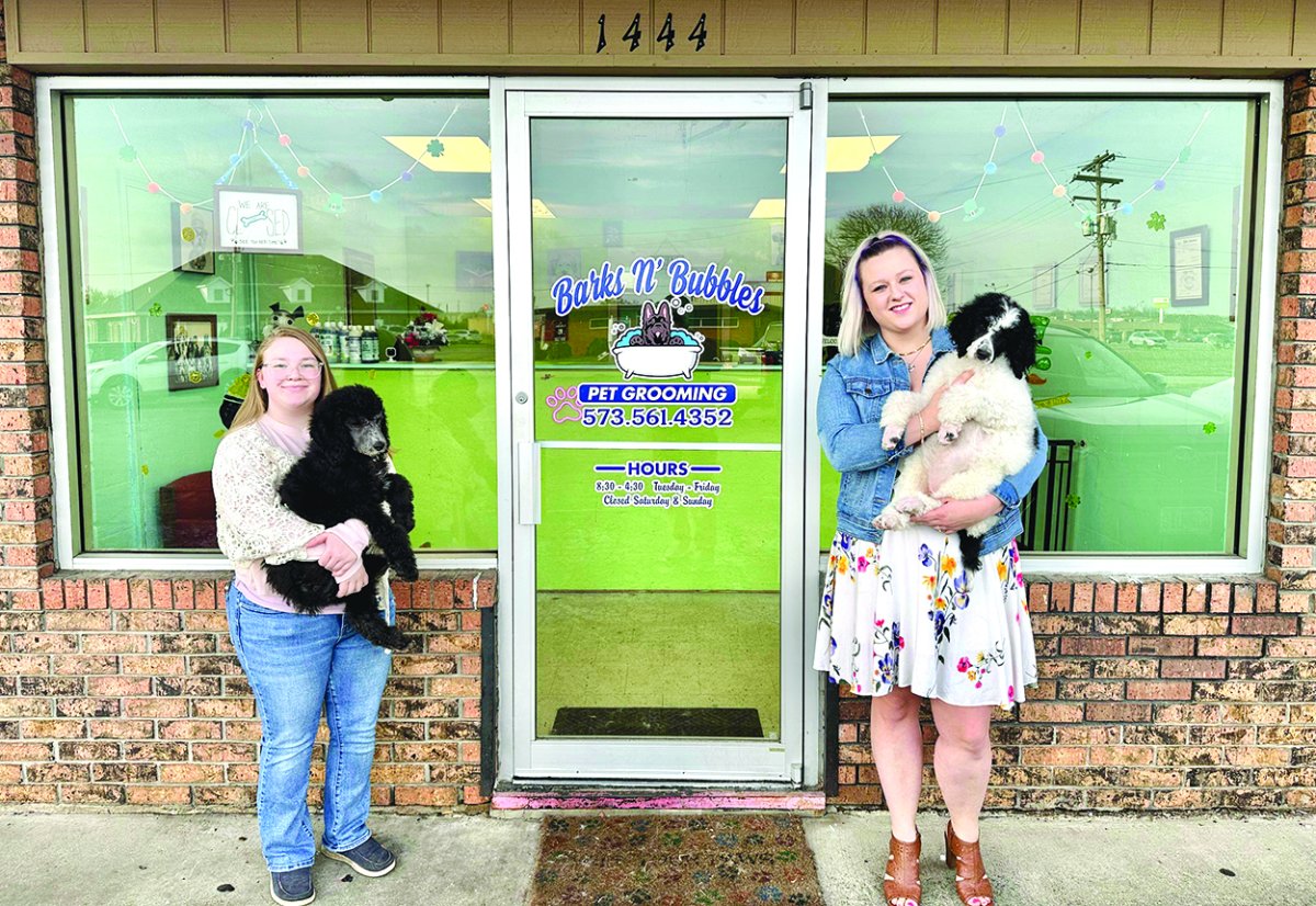 Pants, Door, Jeans, Portrait. Text: 1444 WE ARE Barks N&#039; Bubbles PET GROOMING 573.561.4352 HOURS Closed Saturday &amp; Sunday