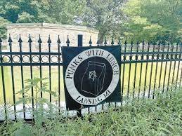 Gate, Fence, Grass, Blackboard. Text: PUNKS WITH LUNCH