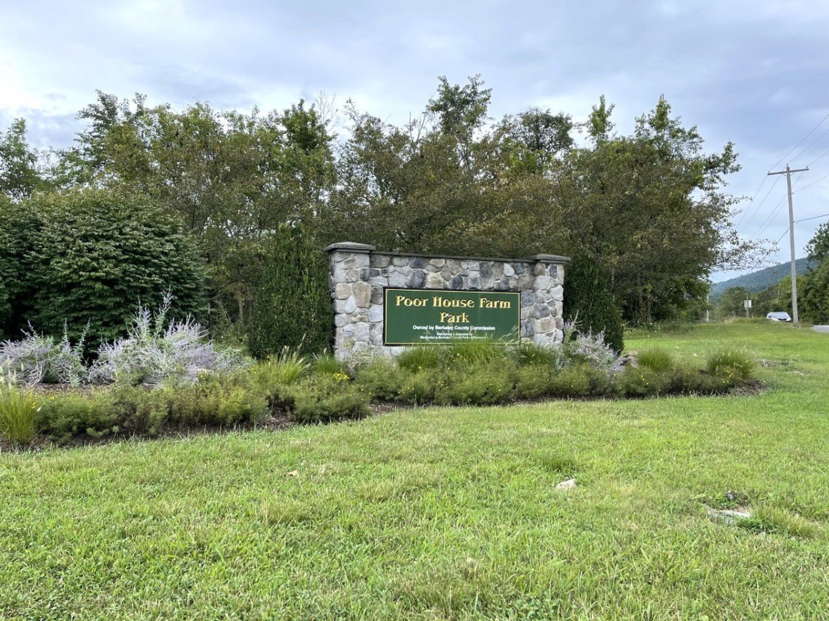 Gravestone, Tomb, Vegetation, Utility Pole. Text: Poor House Farm Park