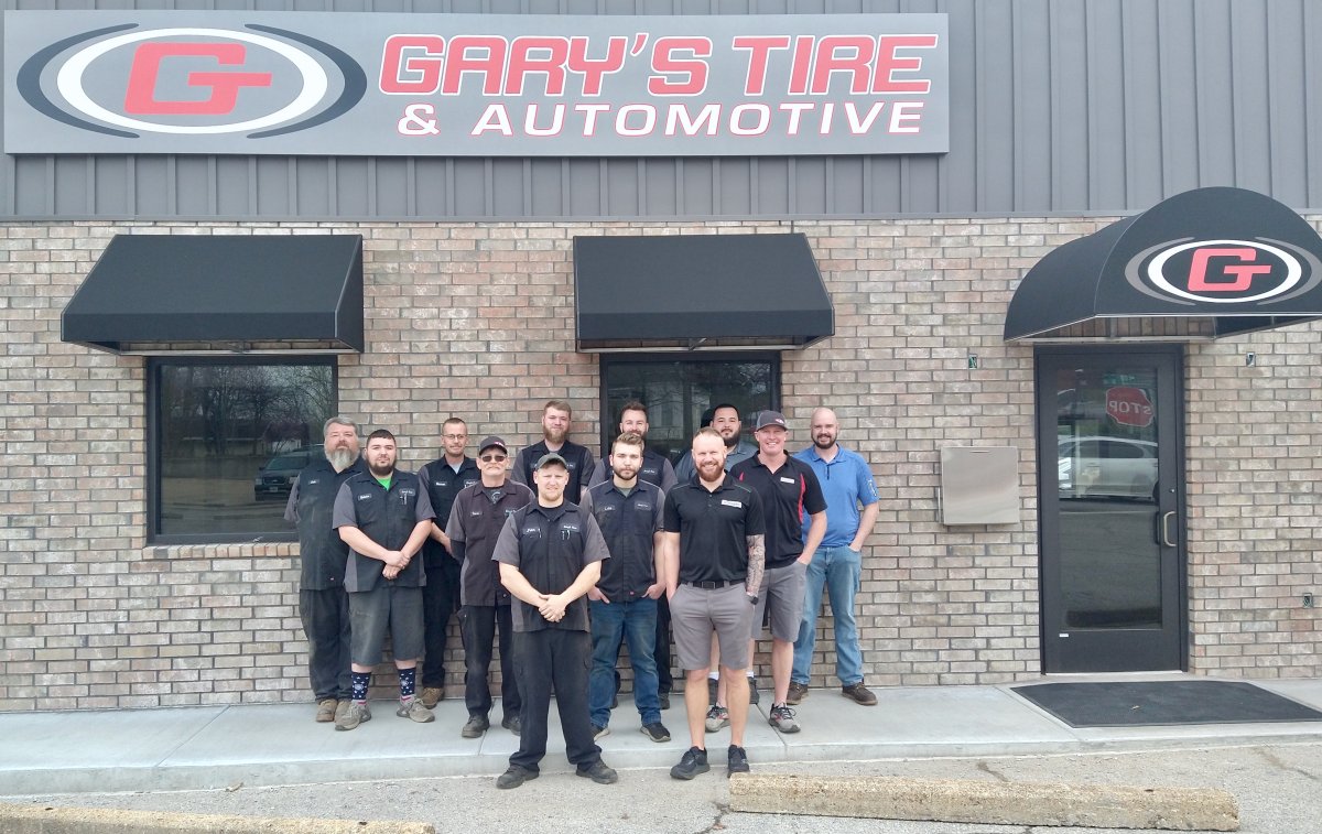 Pants, Shelter, People, Jeans. Text: GARY&#039;S TIRE G &amp; AUTOMOTIVE G