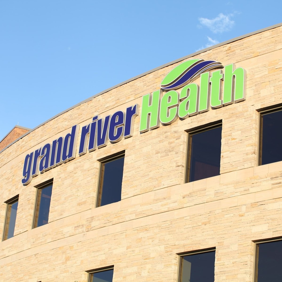 Building, Office Building, Logo, Factory. Text: grand river Health