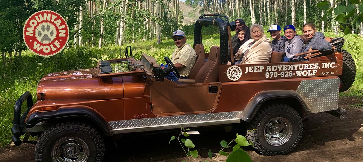 Adult, Female, Person, Woman. Text: MOUNTAIN WOLF JEEP ADVENTURES, INC. MOUNTAIN 970-926-WOLF PUC ORC-103 WOLF